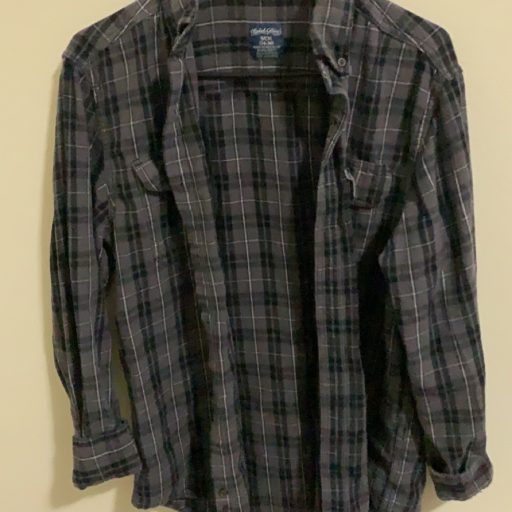 Grey black and white flannel, lightly worn.